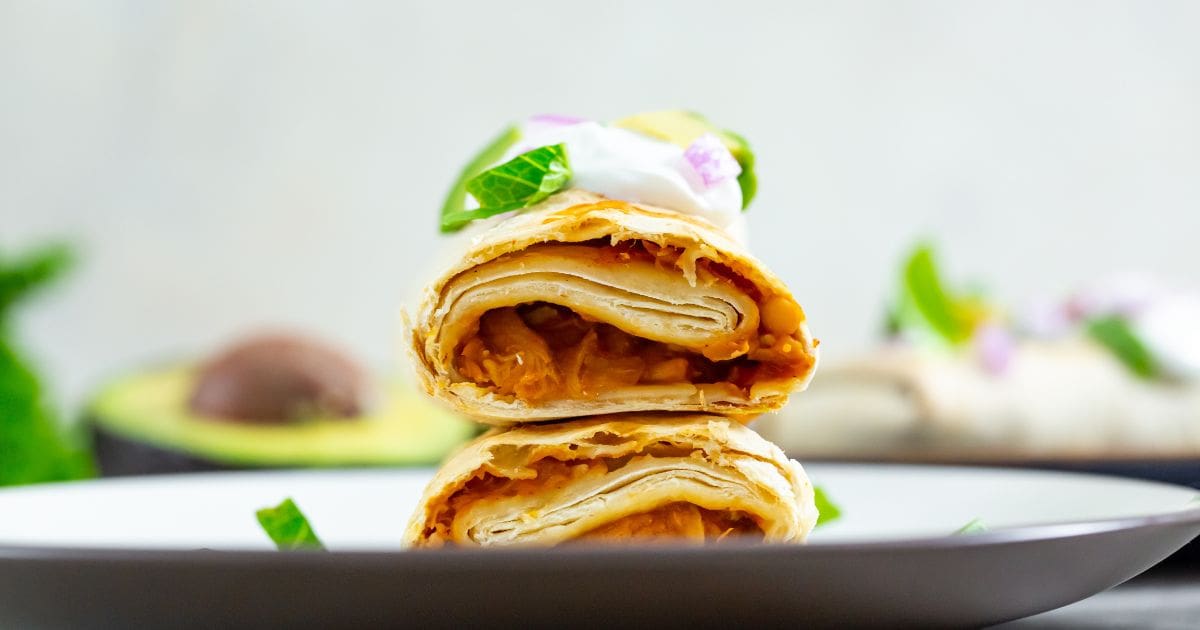 Air Fryer Trader Joes Chicken Burritos burrito with sour cream avocado and lettuce