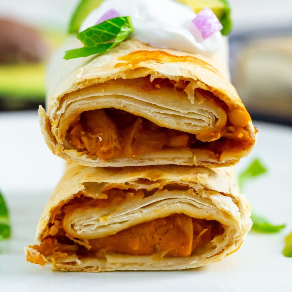 Air Fryer Trader Joes Chicken Burritos burrito with sour cream avocado and lettuce