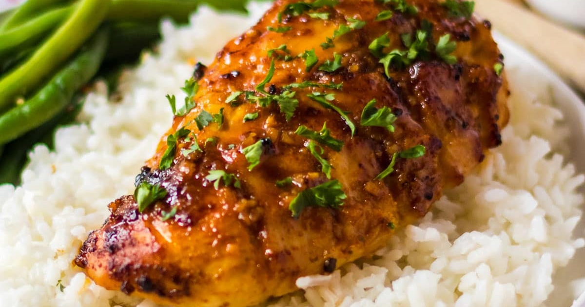 Spicy Air Fryer Chicken Recipes Air Fryer Hot Honey Chicken on White Rice Next to Green Beans on a White Plate