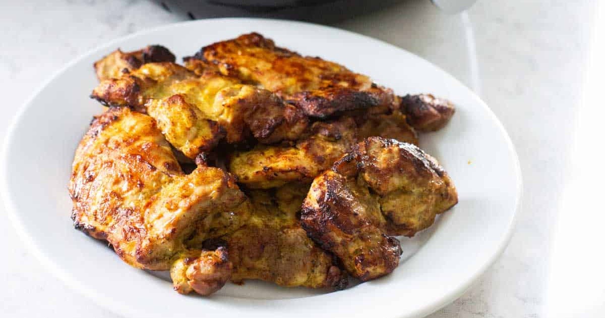 Air Fryer Chicken Marinades Tandoori Marinated Chicken in the Air Fryer Close Up on a White Plate