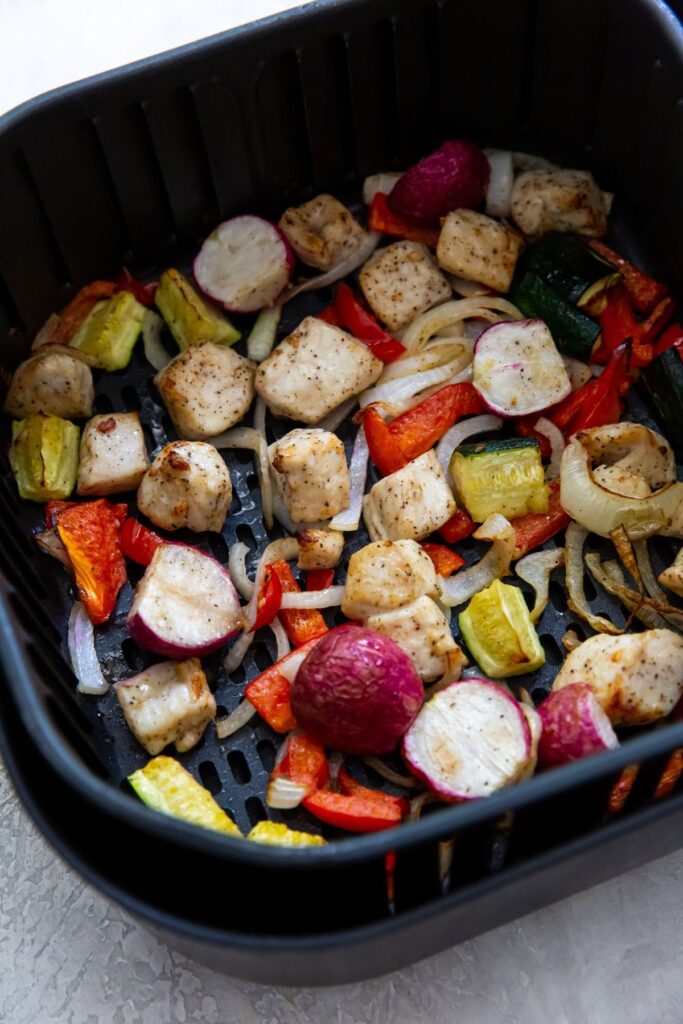 Air Fryer Chicken and Veggies Black Air Fryer with chicken and veggies