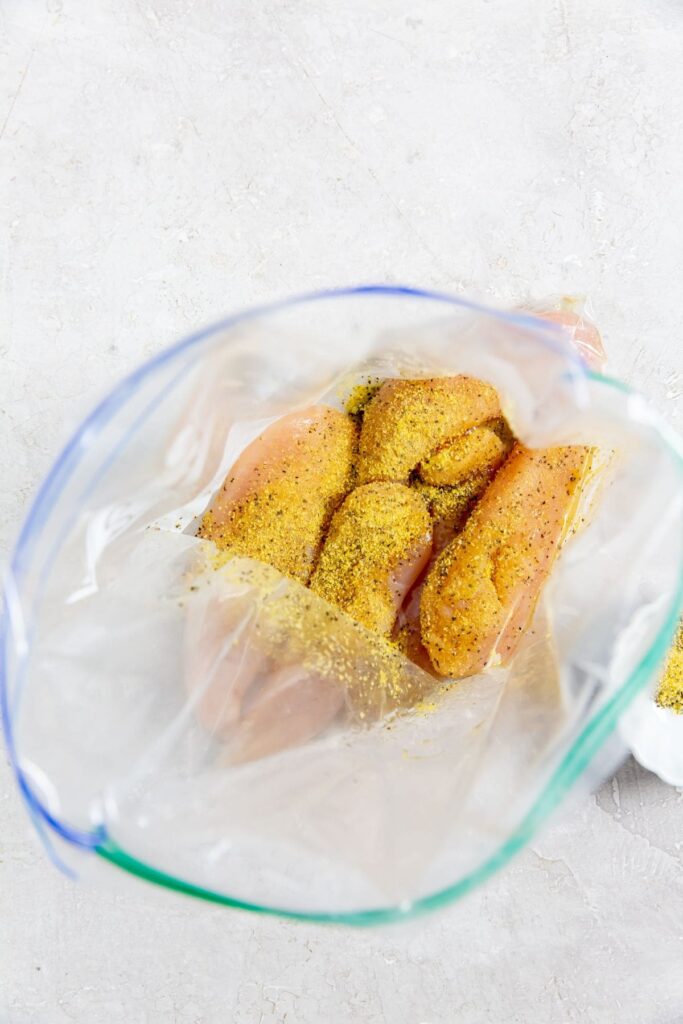 Air Fryer Lemon Pepper Chicken Tenders ziplock bag with chicken inside