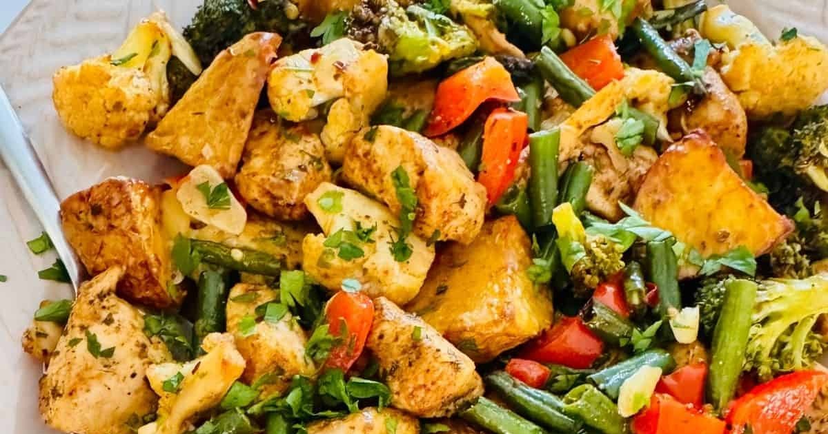 One-Pan Air Fryer Chicken and Veggie Recipes Air Fryer Chicken and Potatoes with Mixed Veggies Close Up