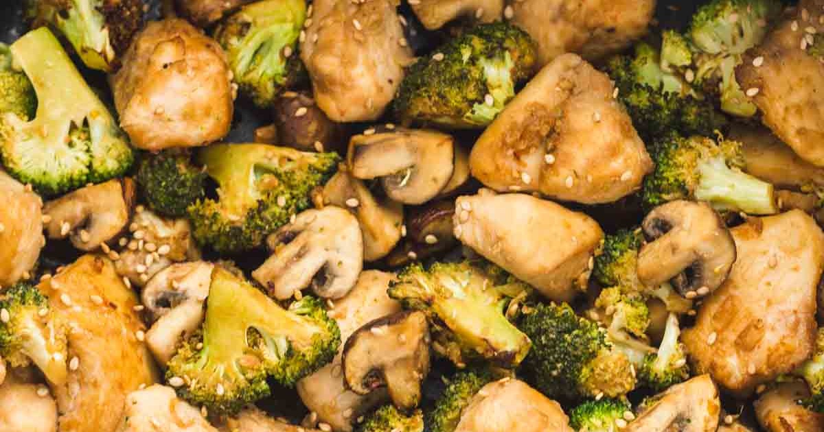 One-Pan Air Fryer Chicken and Veggie Recipes Close Up of Air Fryer Chicken and Broccoli with Sliced Mushrooms