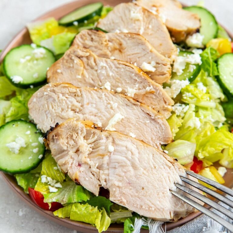 Air Fryer Chicken Salad Recipes Close Up of Italian Chicken Sliced on a Salad in a Bowl with a Fork