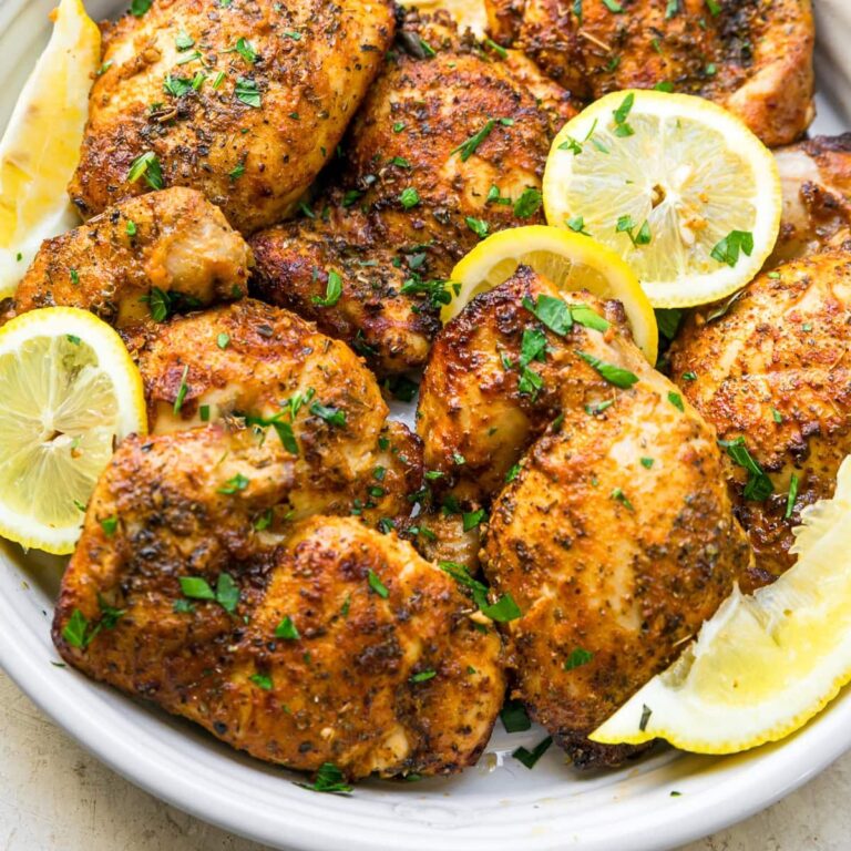 Weight Watchers Air Fryer Chicken Thigh Recipes Close Up of Cooked Chicken with Lemon Slices on a Serving Platter