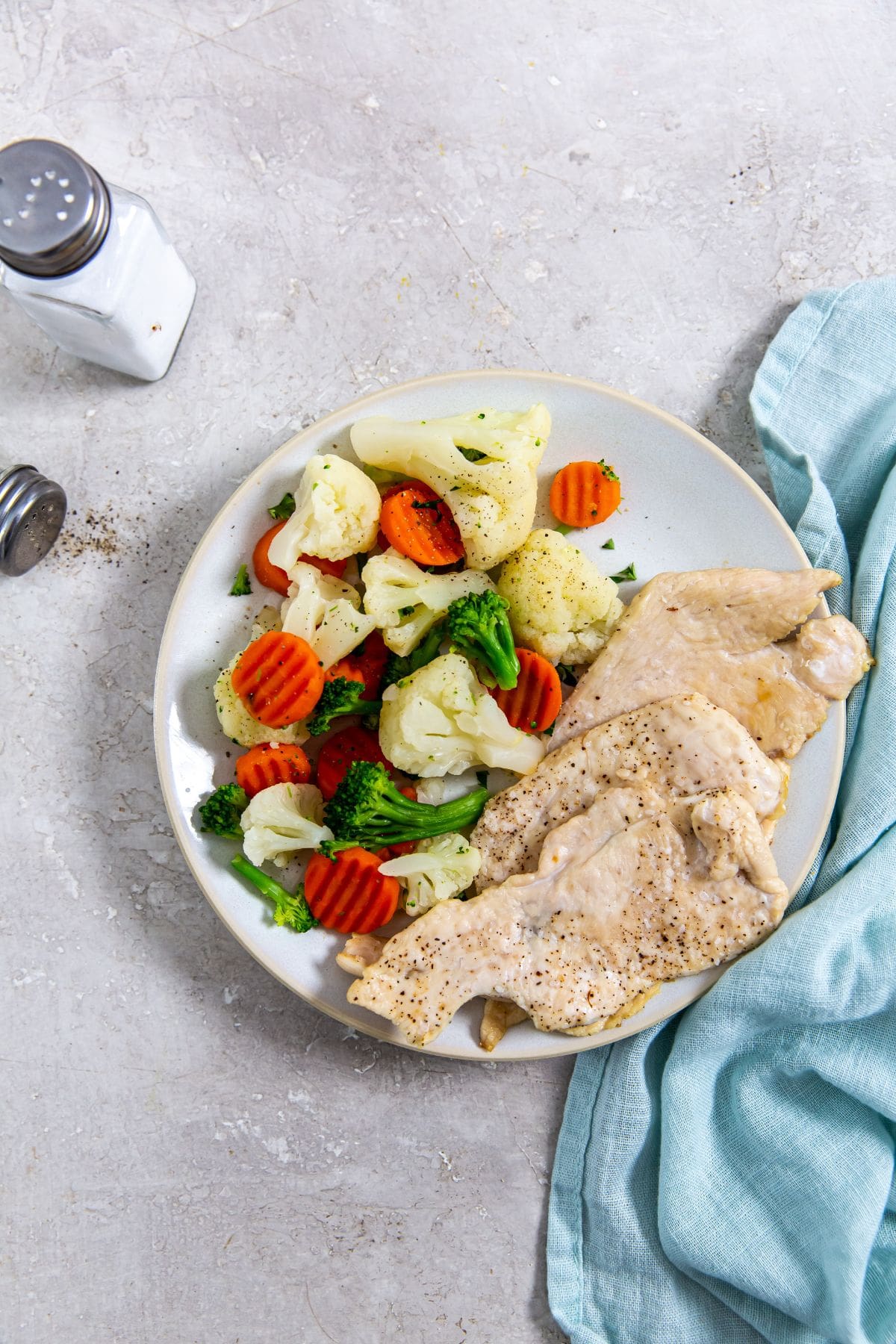 Air Fryer Thin Sliced Chicken Breast chicken breast and vegetables.