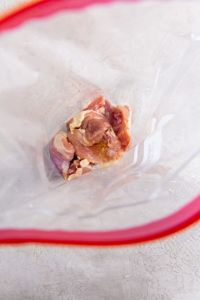 Easy Air Fryer Boneless Skinless Chicken Thighs ziplock bag with chicken inside