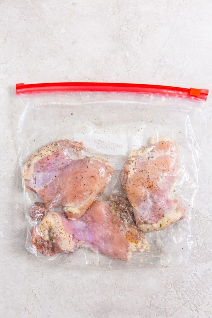 Easy Air Fryer Boneless Skinless Chicken Thighs ziplock bag sealed with chicken Inside.