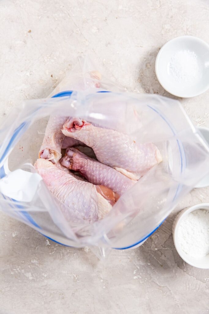 Air Fryer Crispy Chicken Legs ziplock bag with chicken inside