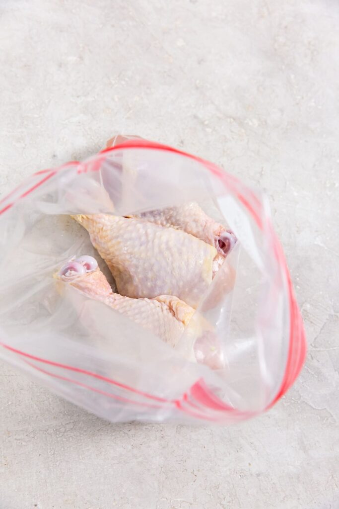 Easy Air Fryer Chicken Legs with Dry Rub ziplock bag with chicken inside