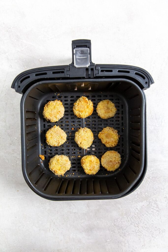 Homemade Air Fryer Chicken Nuggets Recipe black air fryer with cooked chicken inside