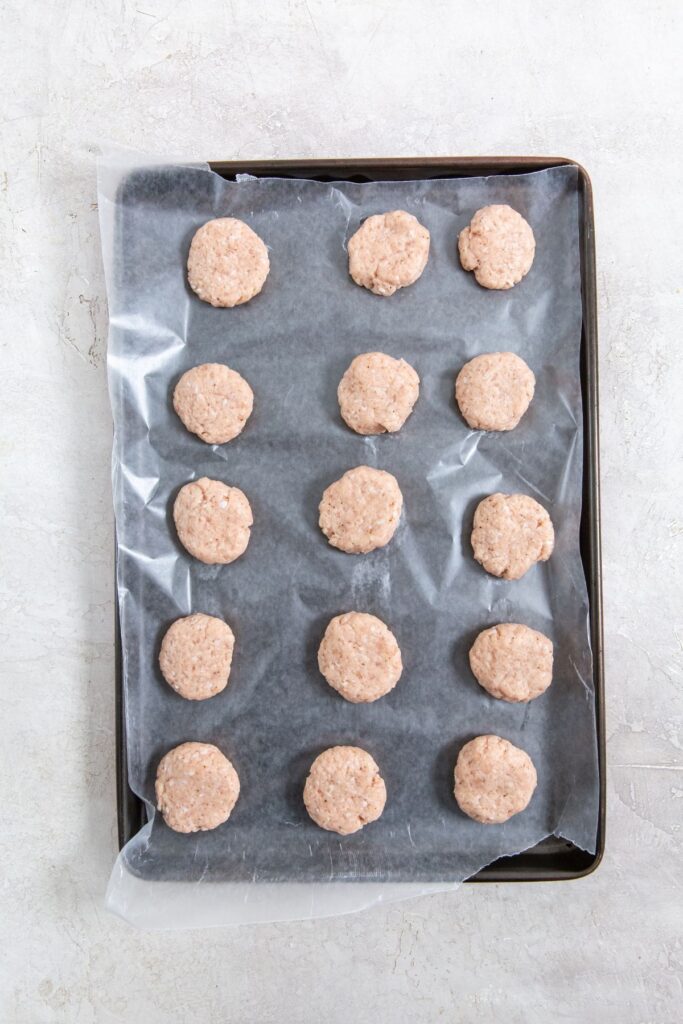 Homemade Air Fryer Chicken Nuggets Recipe Ground Chicken Nuggets Raw in Circles on a Baking Tray