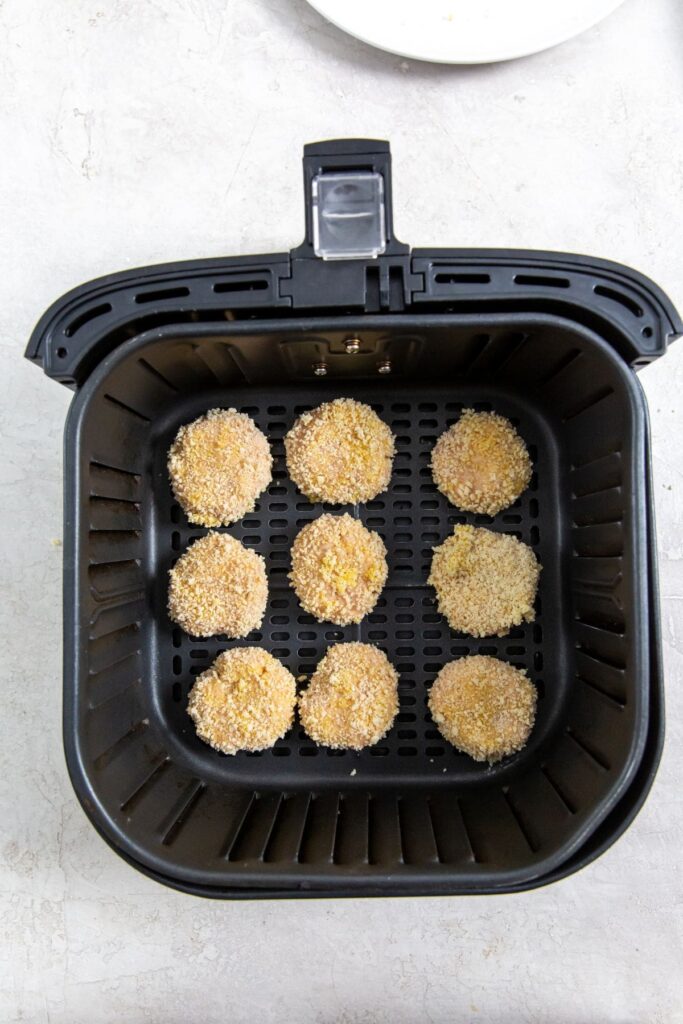 Homemade Air Fryer Chicken Nuggets Recipe black air fryer with raw chicken inside